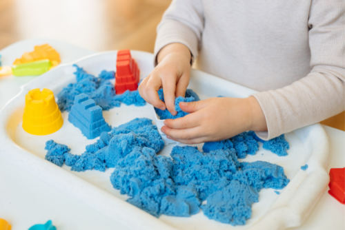 Kids hands playing with sensory toys